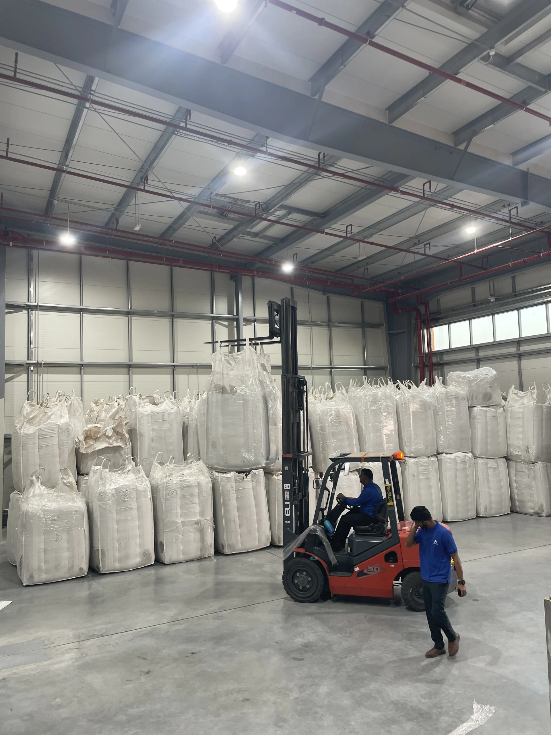 Forklift handling warehouse cargo for storage and logistics operations in UAE Freezone warehouse